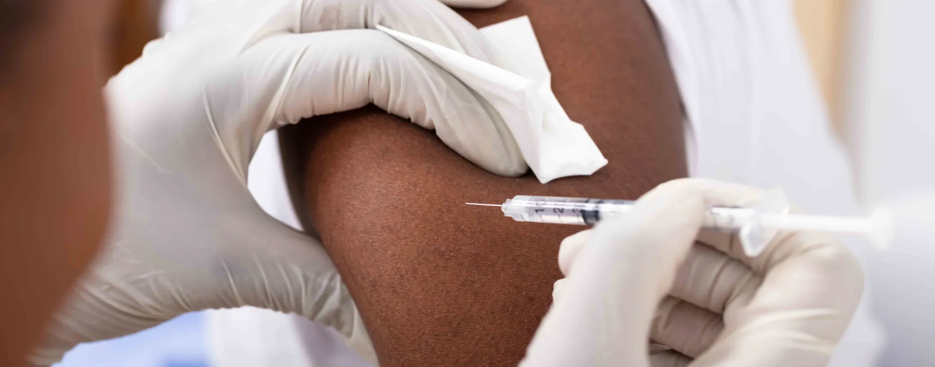 Close Up Person Getting A Vaccine Injection 244160917